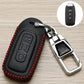 Black key fob cover with red stitched edges and metal keyring clip
