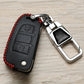 Black car key cover with red stitching and metal keychain loop buckle