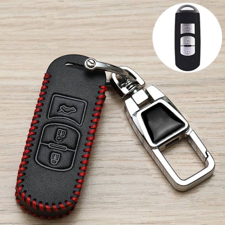 Black leather key fob cover with red stitching, logo icons, and metal keychain clasp