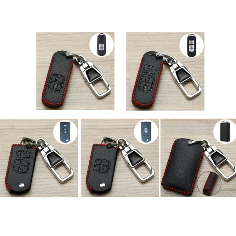Set of black leather key fob covers with red stitching and chrome metal clasps