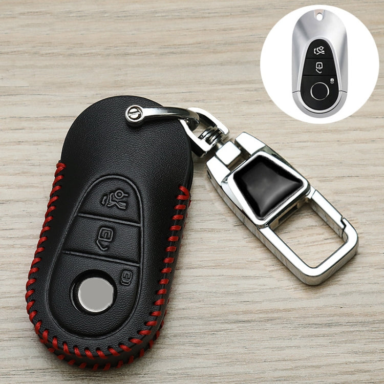 Black leather key fob cover with red stitched trim and chrome metal keychain loop