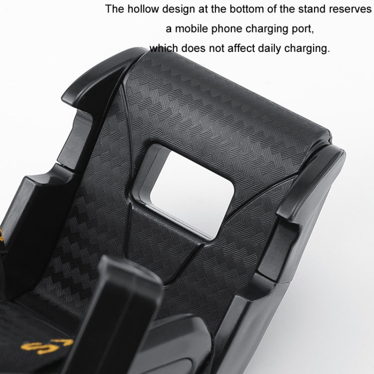 Close-up of black car phone holder cradle with textured surface and open charging port