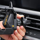Car air outlet phone holder being adjusted by hand on dashboard air vent