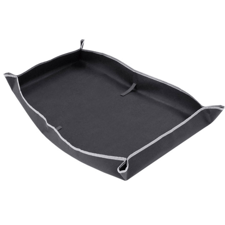 Black waterproof trunk protective pad with raised edges and corner loops