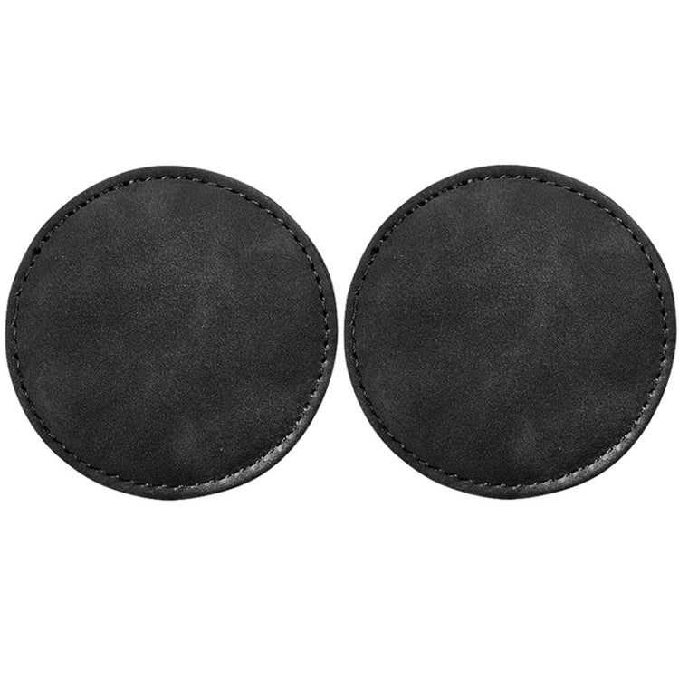 Set of 2 round black suede car coasters with stitched edges, anti-slip pads.