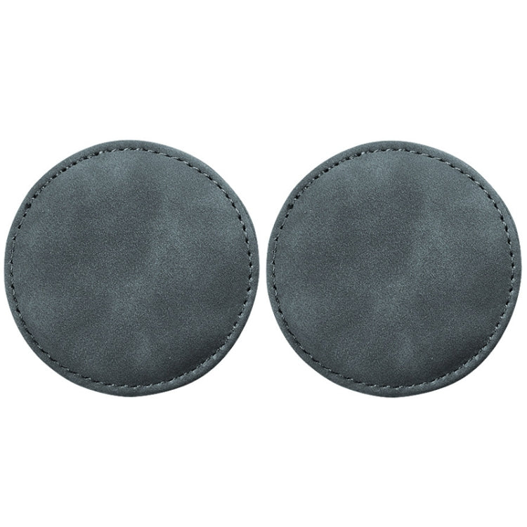 Set of 2 round gray suede car coasters with stitched edges, anti-slip pads.