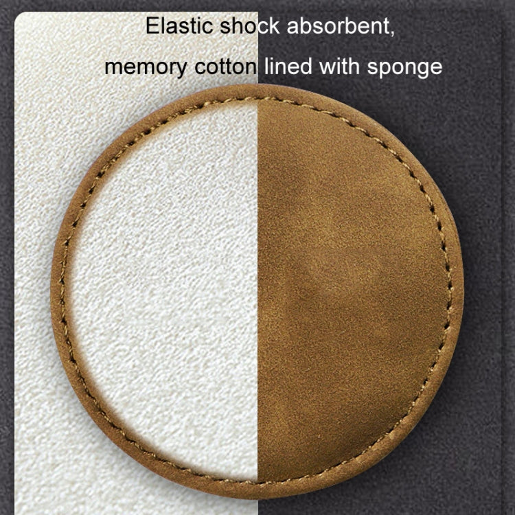 Round two-tone suede car coaster with stitched edge, white backing visible.