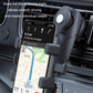 Car phone holder mounted on air vent with spring arms holding a phone