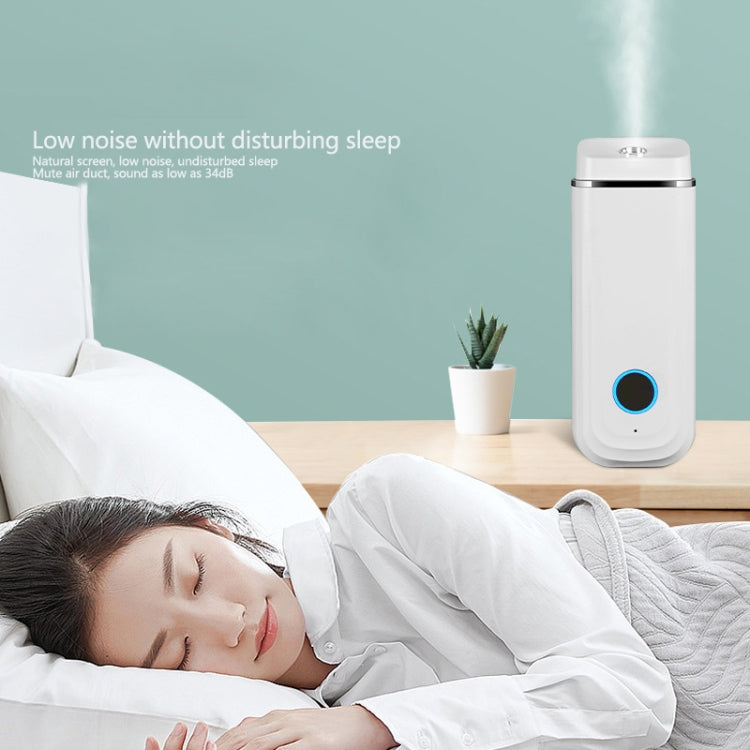 White aroma diffuser humidifier cylinder with blue LED ring, standing on table