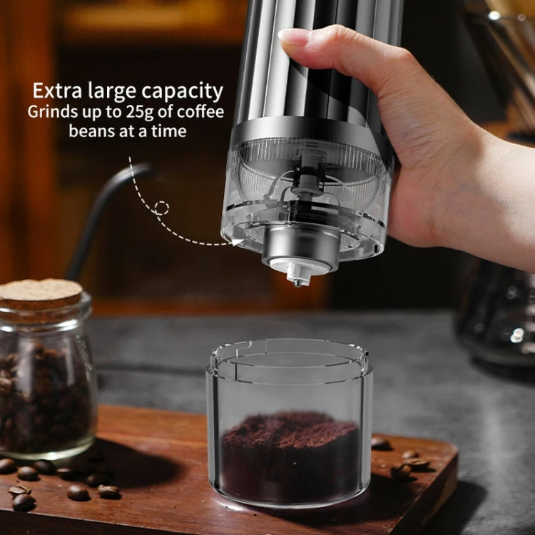 Automatic coffee grinder with hand lifting top, clear chamber with visible grounds