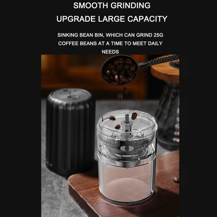 Automatic coffee grinder with clear container holding dark coffee beans