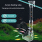 Hanging acrylic fish tank feeding tube with suction-style mounting and funnel