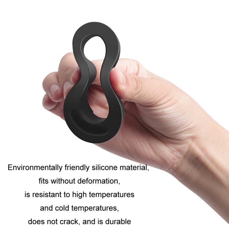 Hand holding black wiper filler gap plug with loop pull