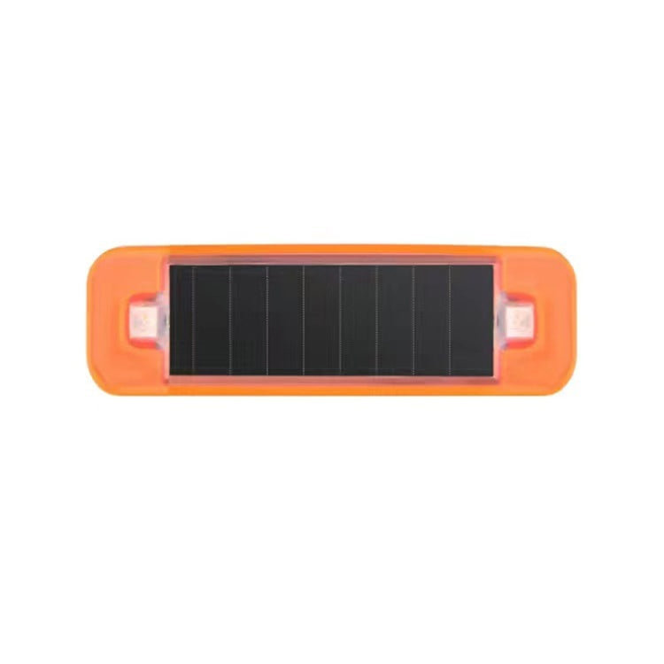 Solar warning light bar with orange housing and clear side lenses