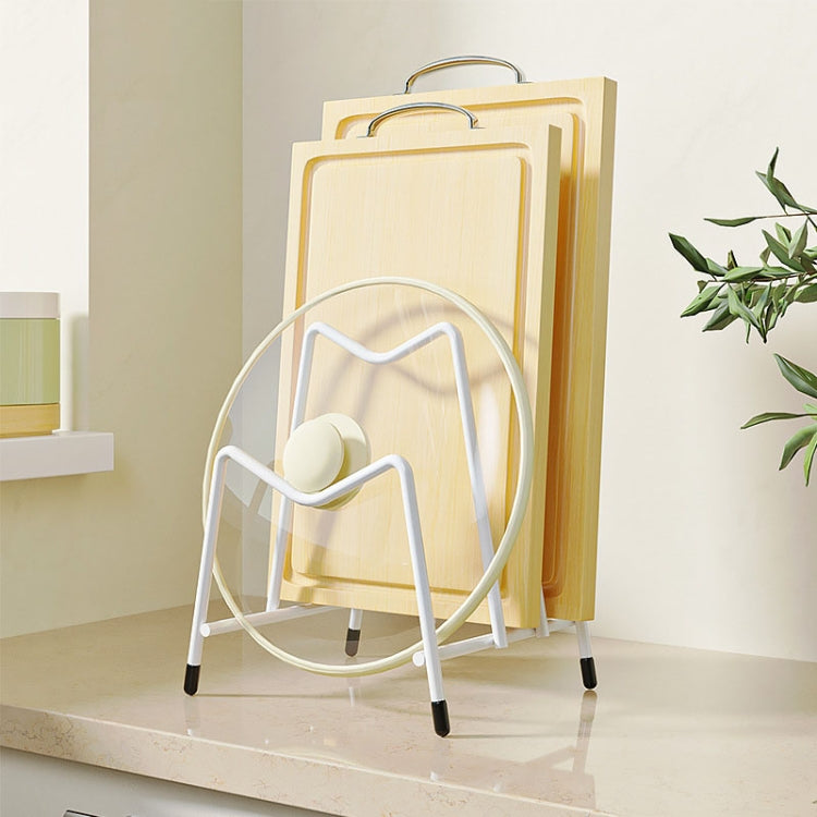 White countertop rack holding stacked cutting boards with circular pot lid section