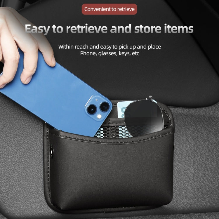 Black adhesive storage pouch with open top, holding a phone and small accessories