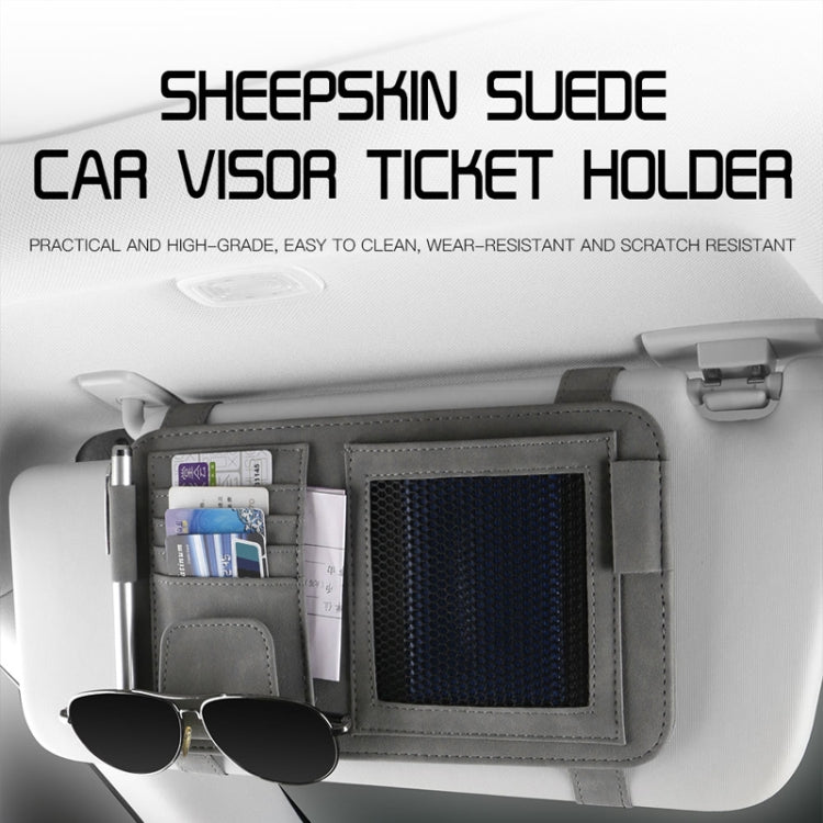 Car visor storage bag with mesh pocket and attached glasses clip.