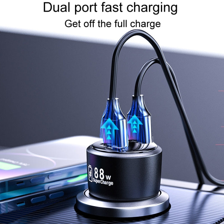 Black dual-port car fast charger base on dashboard, showing USB charging output
