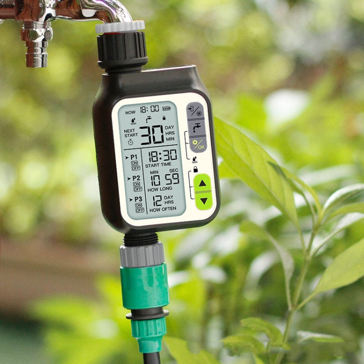 Automatic rain-sensor water timer attached to a faucet with green filter fitting