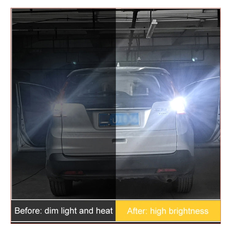 Lit automotive LED reversing light beam with two bright white bulbs on vehicle