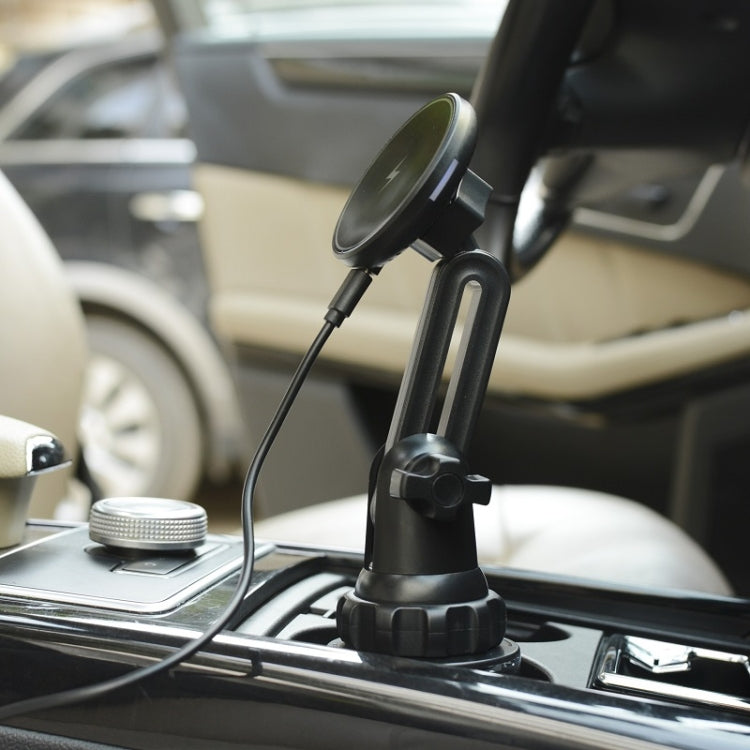 Black car cup holder wireless charger with charging head and cable on console