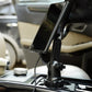 Black MagSafe wireless charging mount holding a smartphone in a car cup holder