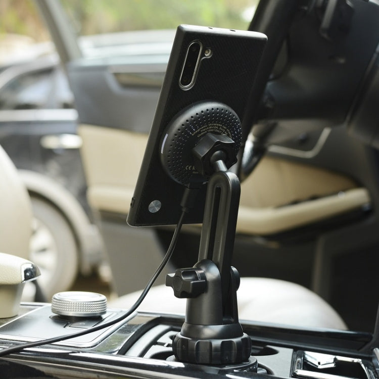 Black car cup holder wireless charging mount with phone attached and cable connected