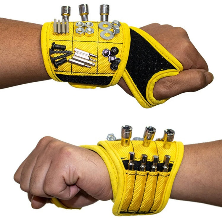 Yellow magnetic thumb wrap tool storage strap on wrist with multiple tools held