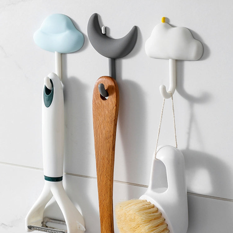 Three non-marking adhesive wall hooks in blue, gray, and white