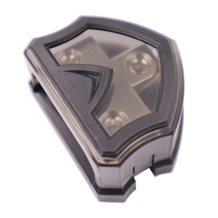Black fuse hub cover with triangular slot detail and side mounting tabs