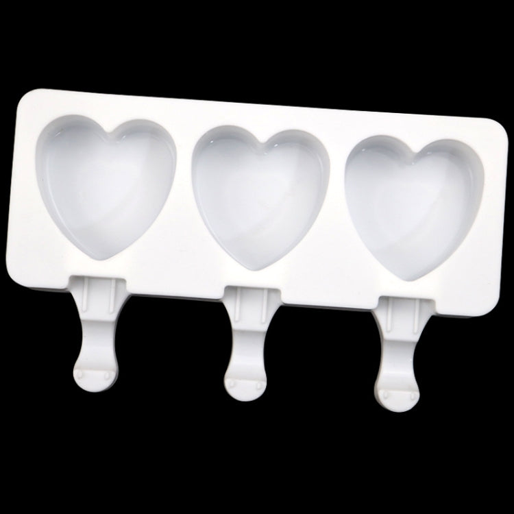 White 3-cavity heart ice pop mold tray with three stick-shaped handles