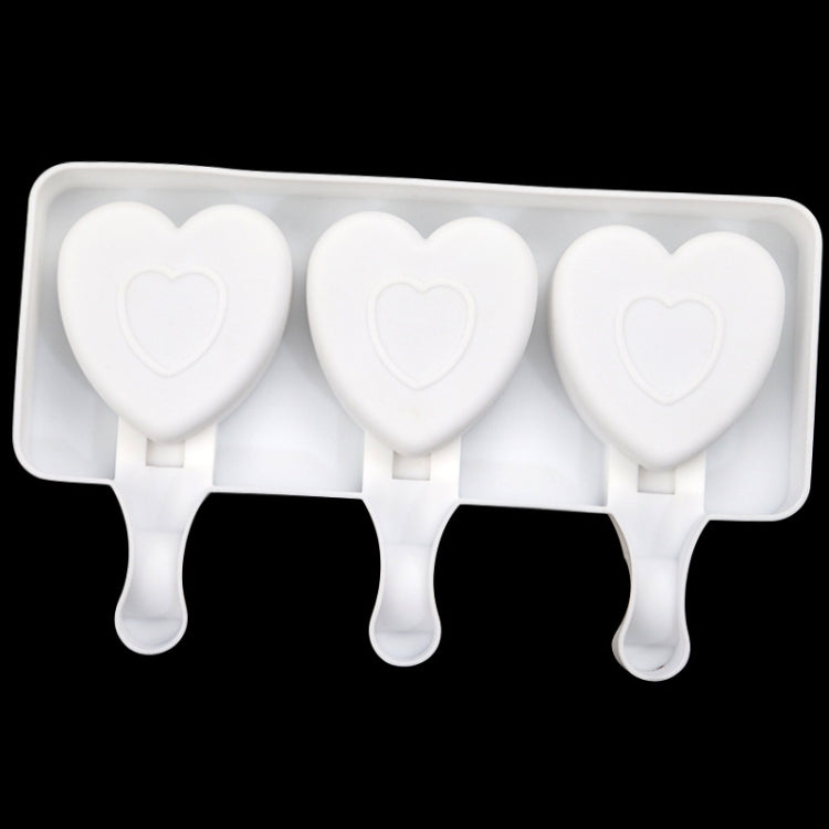 White heart ice pop mold tray with three heart cavities and three handles