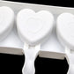 Heart-shaped cavity ice pop mold tray with central heart and rounded handles