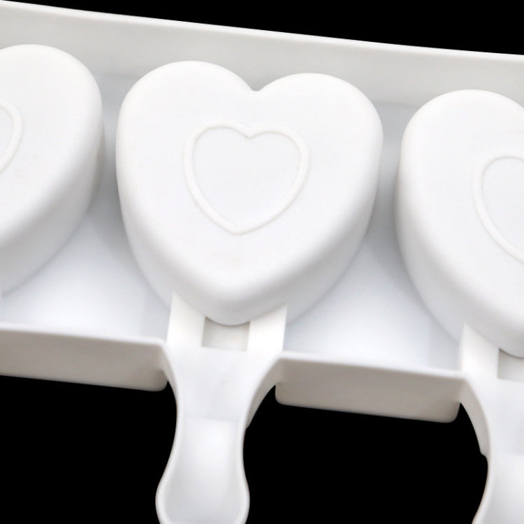 Heart-shaped cavity ice pop mold tray with central heart and rounded handles