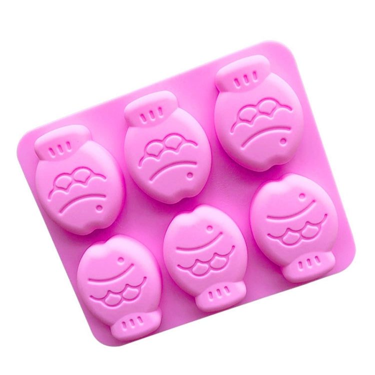 Pink silicone cake/soap mould with six little fish cavities and embossed fish details.