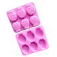 Two pink silicone mould trays, each with six embossed little fish cavities.