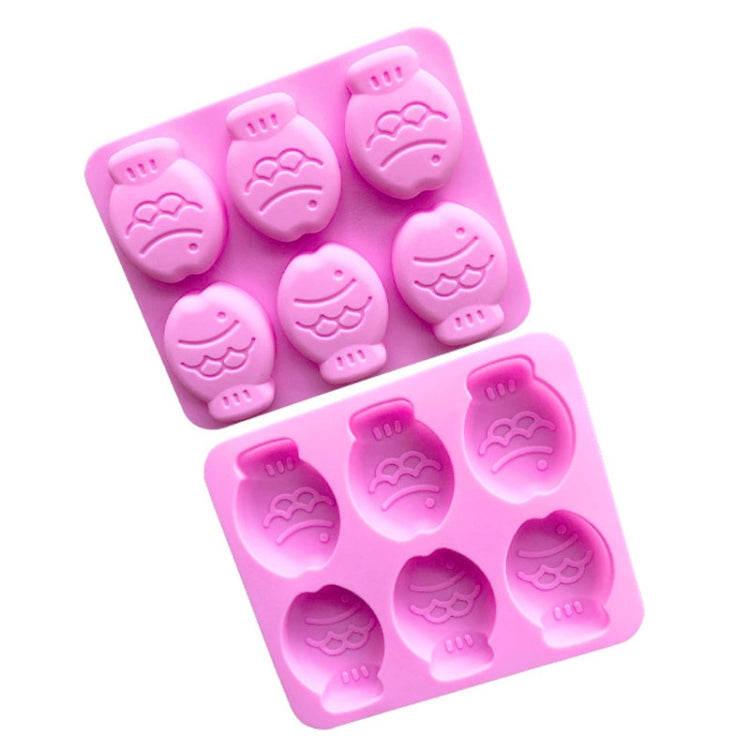 Two pink silicone mould trays, each with six embossed little fish cavities.