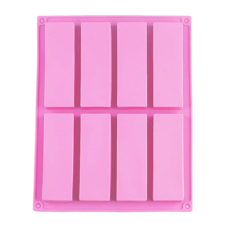 Pink rectangular silicone soap mold with 8 inset cavities and grid lines