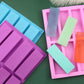 Rectangular silicone soap molds in blue and pink, 8-cavity grid design