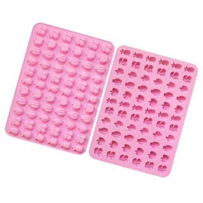 Pink silicone mini candy mold with 66 fruit-shaped cavities, two-panel tray