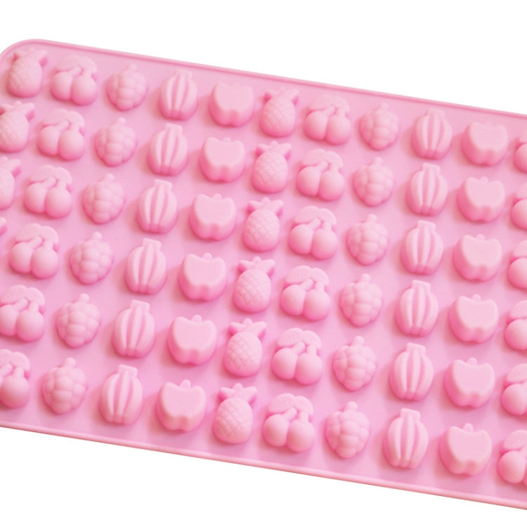 Rectangular pink silicone candy mold with raised fruit and heart-shaped cavity details