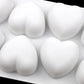 Silicone heart mold filled with four white heart-shaped pieces