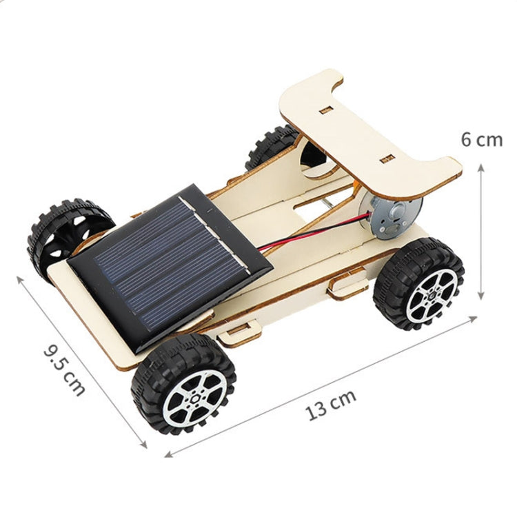 Wooden solar car assembly toy with fold-out chassis, solar panel, motor, and wheels