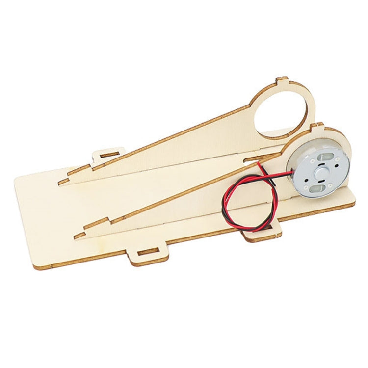 Solar car DIY wooden chassis with built-in motor, red wires, and mounting cutouts