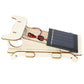 Wooden solar car kit side view showing solar panel, red wiring, and motor module