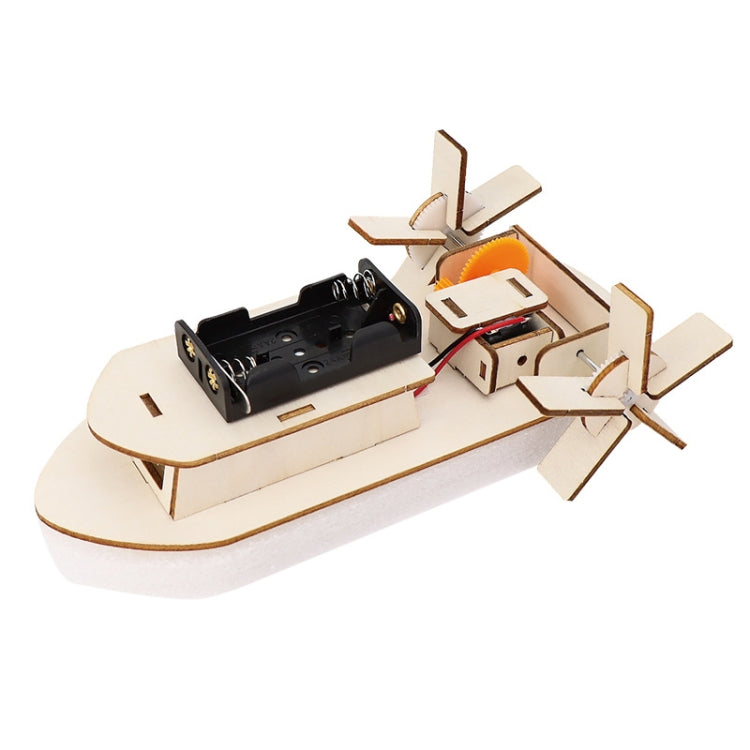 DIY electric boat model kit with wooden hull, motor, and propeller parts