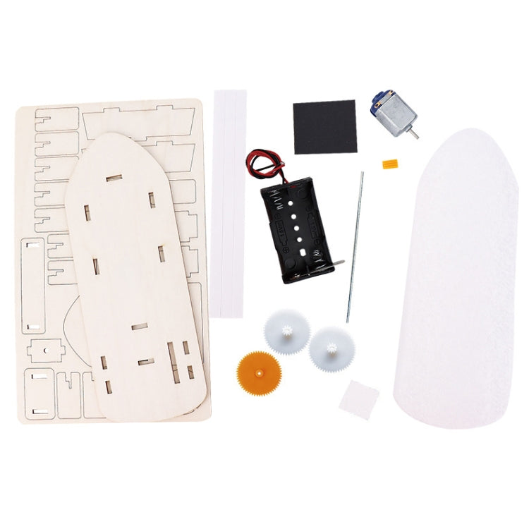 DIY electric boat model kit parts: wooden pieces, motor, battery holder, foam sail