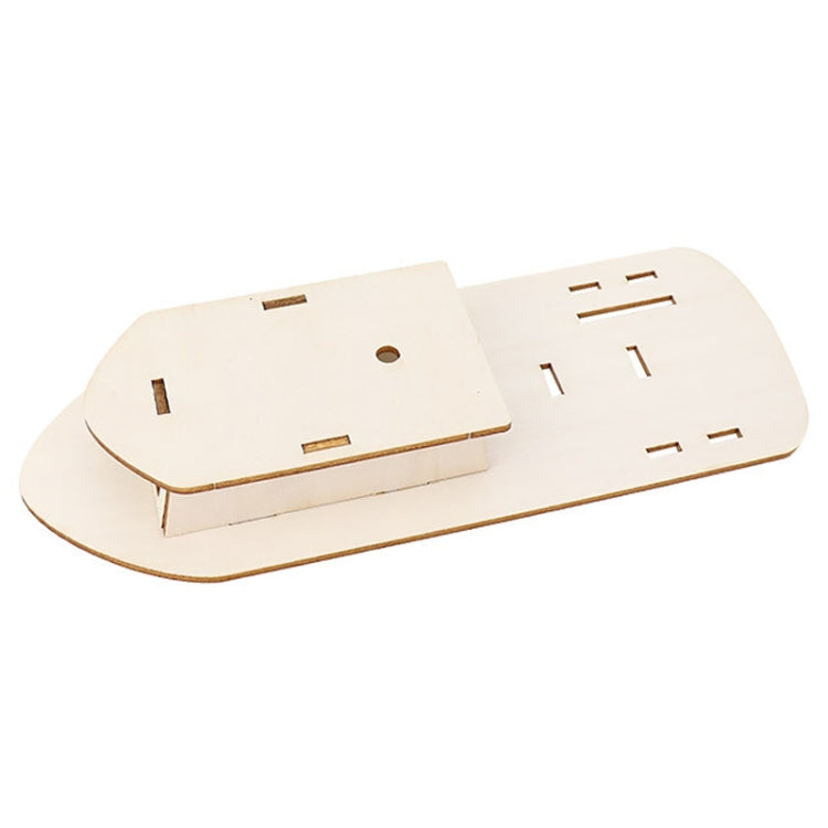 Wooden boat hull panel with precut compartments and mounting holes for the kit