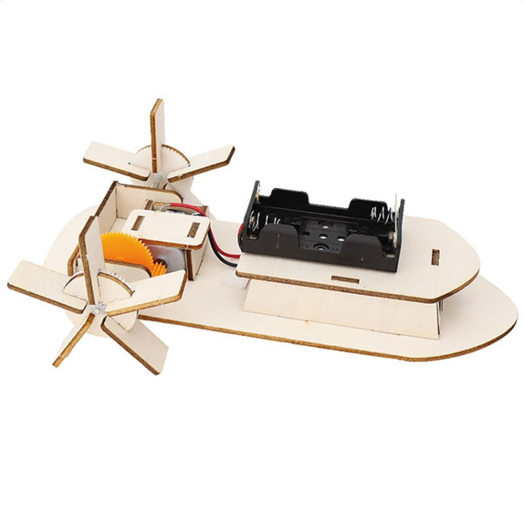 Electric DIY boat model showing propeller, sail mast, and motor on the wooden hull