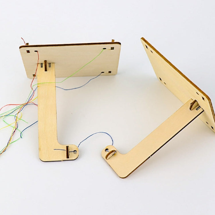 Wood physics balance toy parts with multicolored strings and wire guide cutouts